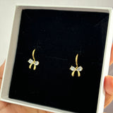 Bow huggie earrings