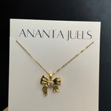 Studded bow necklace