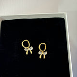 Bow huggie earrings