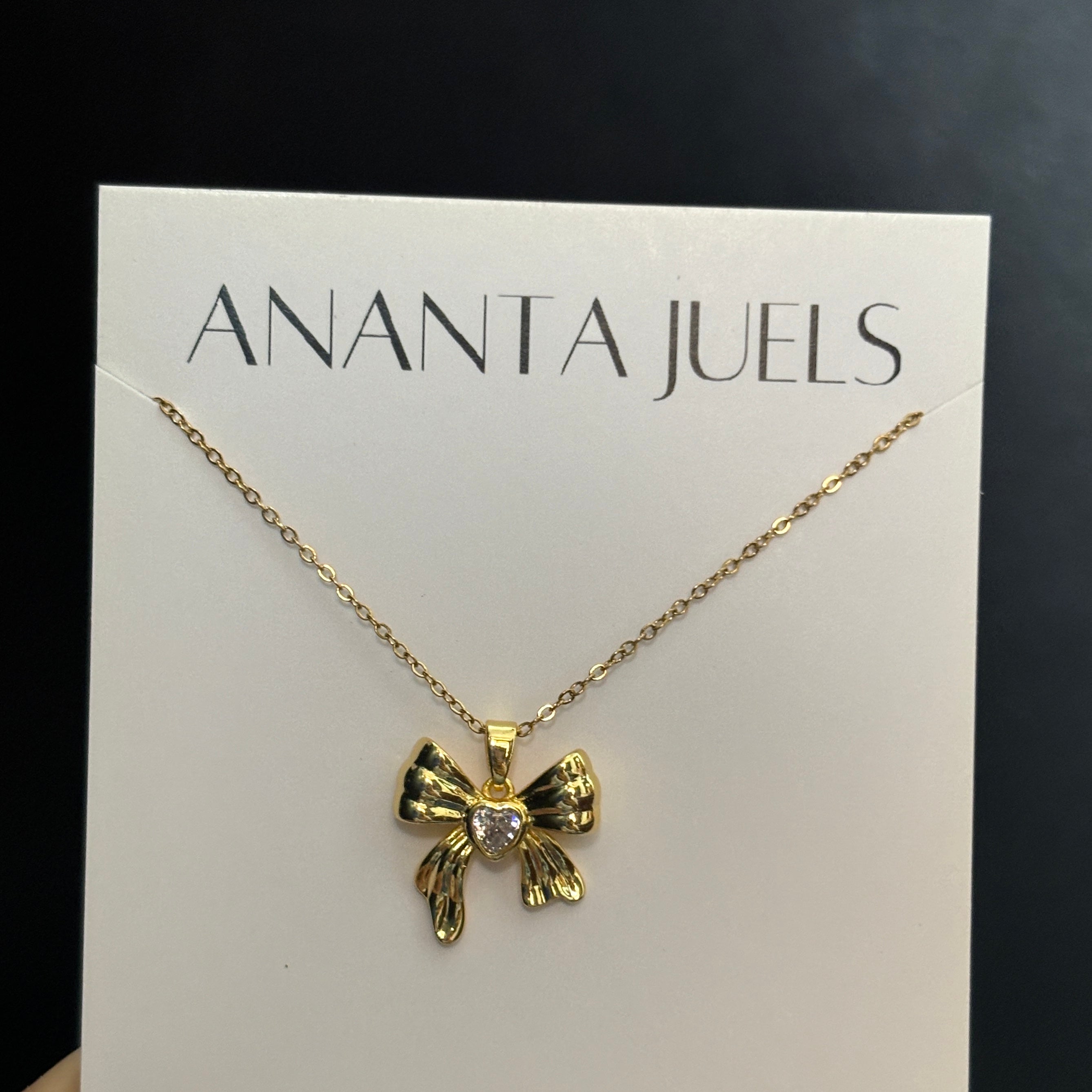 Studded bow necklace