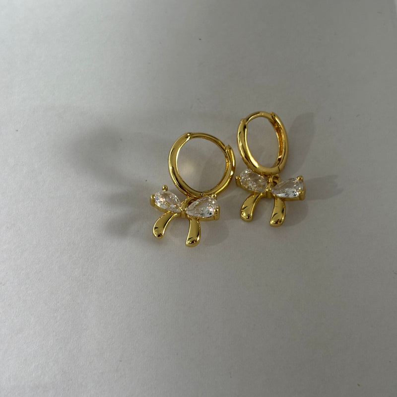 Bow huggie earrings